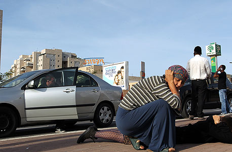 תושבים באשקלון בעת אזעקה (ארכיון), צילום: גיל נחושתן 