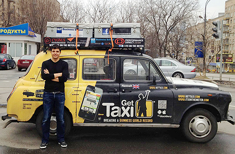 Gett CEO Shahar Waiser in front of a company taxi in Russia. Photo: Nimrod May