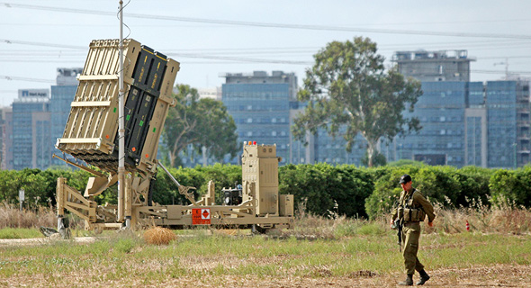 An Israeli soldier protects an Iron Dome battery. Photo: Amit Shaal