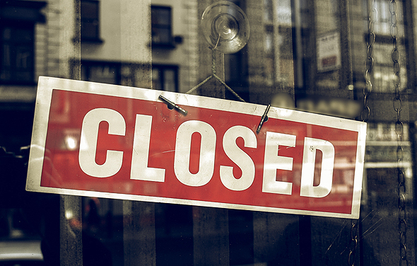 A closed for business sign. Photo: Shutterstock