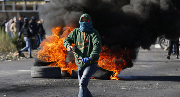 Palestinian protester in Ramalla. Photo: AFP