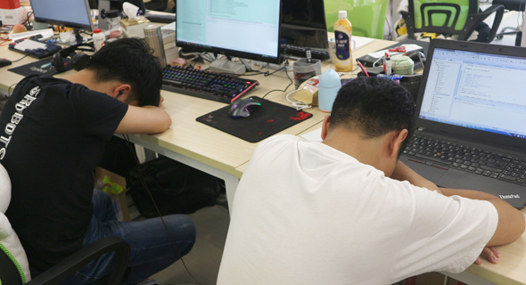 Workers taking a nap at Shanghai-based startup LeapLearner. Photo: Ami Dror