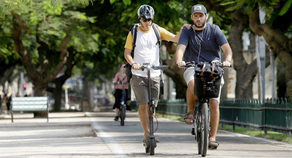 E-bike and E-scooter users in Tel Aviv. Photo: Amit Sha'al E-bike and E-scooter users in Tel Aviv. Photo: Amit Sha'al