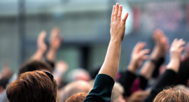 Raising a hand to help. Photo: Shutterstock