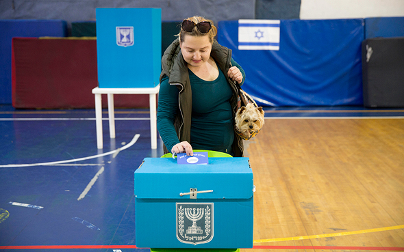A woman voting in Israel's April 2019 election. Photo: AP A woman voting in Israel's April 2019 election. Photo: AP