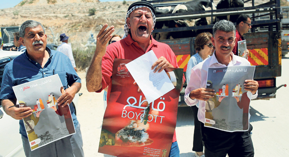 Palestinians demonstrating for the boycott of Israeli goods. Photo: AFP Palestinians demonstrating for the boycott of Israeli goods. Photo: AFP