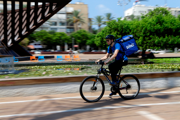 Wolt delivery person in Tel Aviv. Photo: Amit Sha