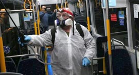 Cleaning the bus in Israel because of coronavirus. Photo: Motti Kimchi