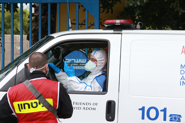 An ambulance taking a corona patient to Wolfson Medical Center in Holon. Photo: Avigail Uzi