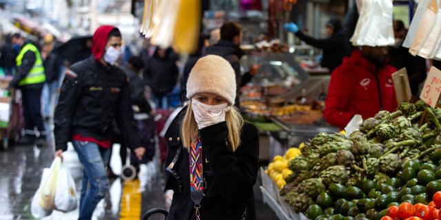 Shoppers at the Machane Yehuda Market in Jerusalem during the Covid-19 outbreak. Photo: Amit Shabi