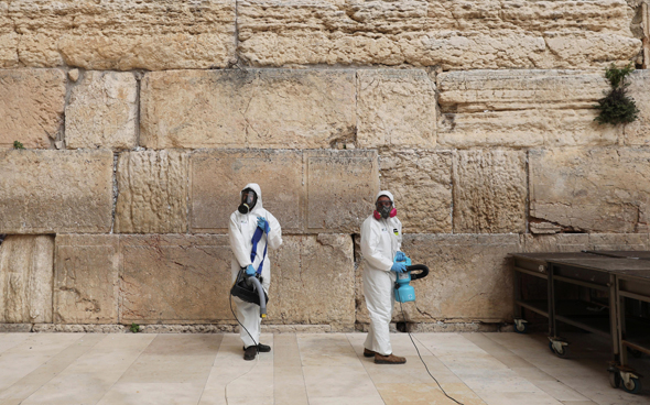 Coronavirus sanitizing at the Western Wall in Jerusalem. Photo: API Coronavirus sanitizing at the Western Wall in Jerusalem. Photo: API
