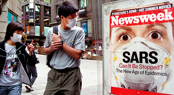 People on the streets of Honk Kong during SARS outbreak in 2003. Photo: AP People on the streets of Honk Kong during SARS outbreak in 2003. Photo: AP