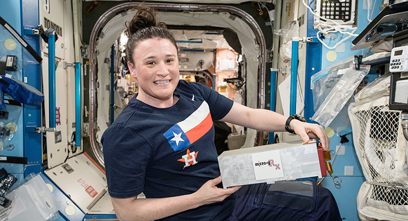 An astronaut at the ISS holding one of SpacePharma's miniature labs. Photo: NASA An astronaut at the ISS holding one of SpacePharma's miniature labs. Photo: NASA