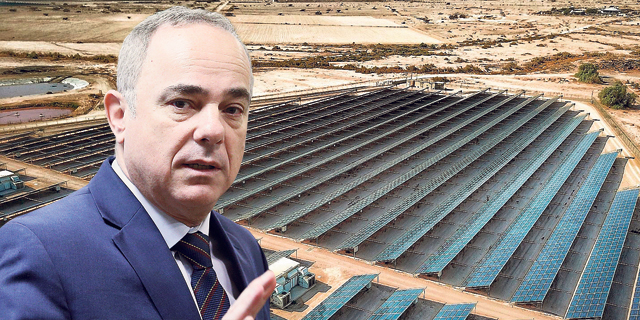 Energy Minister Yuval Steinitz on the backdrop of a solar energy field. Photo: Ohad Zwiegenberg and Rom Karmi