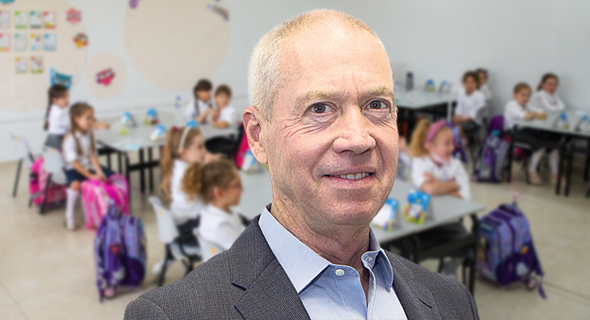 Education Minister Yoav Galant handed out 150,00 laptops to underprivileged children. Photo: Nimrod Glickman