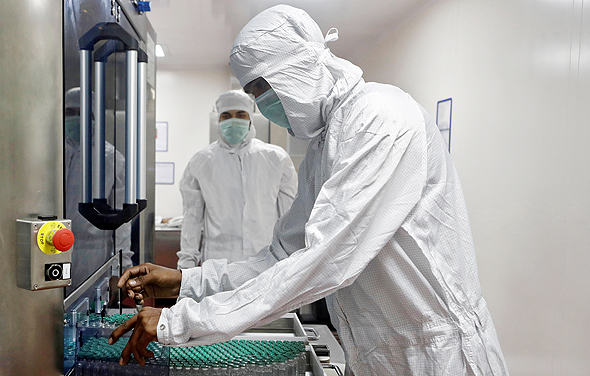 Scientists working on a Covid-19 vaccine at AstraZeneca Labs. Photo: Reuters Scientists working on a Covid-19 vaccine at AstraZeneca Labs. Photo: Reuters
