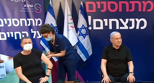 Health Minister Yuli Edelstein and Prime Minister Benjamin Netanyahu were the first Israelis to get vaccinated. Photo: GPO Health Minister Yuli Edelstein and Prime Minister Benjamin Netanyahu were the first Israelis to get vaccinated. Photo: GPO