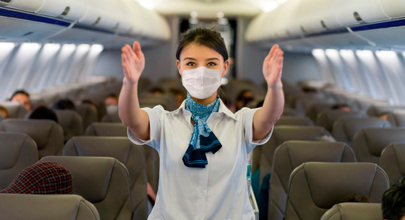 טיסה בטוחה קורונה דיילת מסכה חברת תעופה בטוחה חברות תעופה בטוחות, צילום: גטי אימג'ס