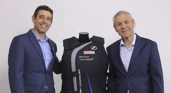 StemRad CEO Dr. Oren Milstein (left) and Director-General of the Israel Space Agency Avi Blasberger hold an AstroRad vest. Photo: StemRad