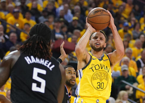 NBA star Steph Curry takes a shot 