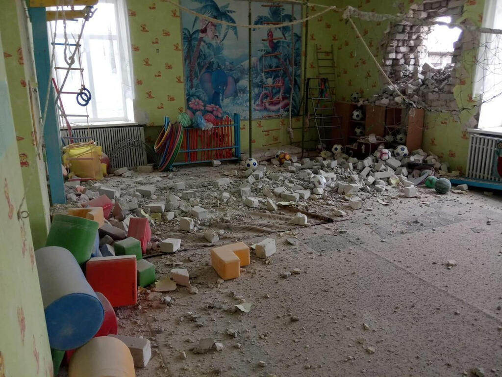 A kindergarten bombed by an exchange of fire between the rebels and the Ukrainian army.  There were no casualties