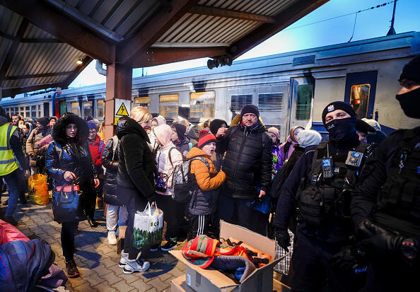 Refugees from Ukraine at a train station on the border with Poland