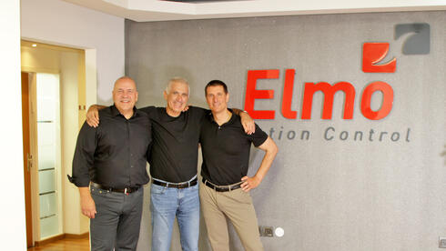 Elmo founder Haim Monhait (center) with Bosch representatives. 